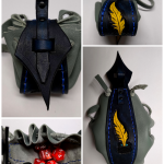 grey leather dice bag with ink and yellow feather