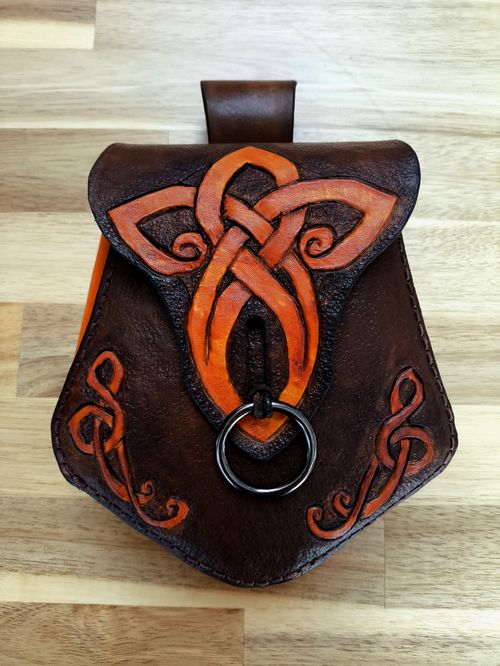 Dark brown leather fantasy pouch with light brown celtic knot.