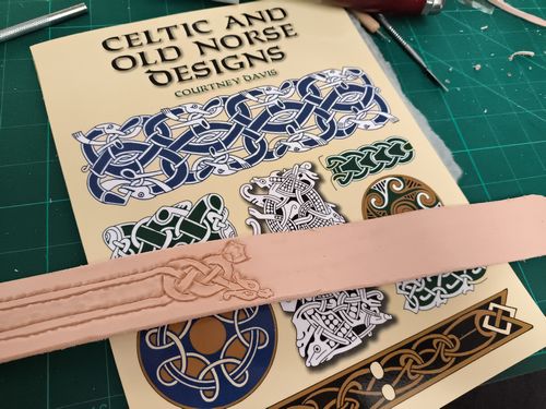 Leather belt with a dragon celtic design.