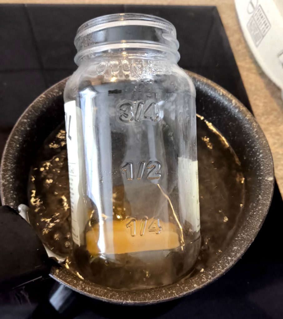 Melting beeswax for viking drinking horn making